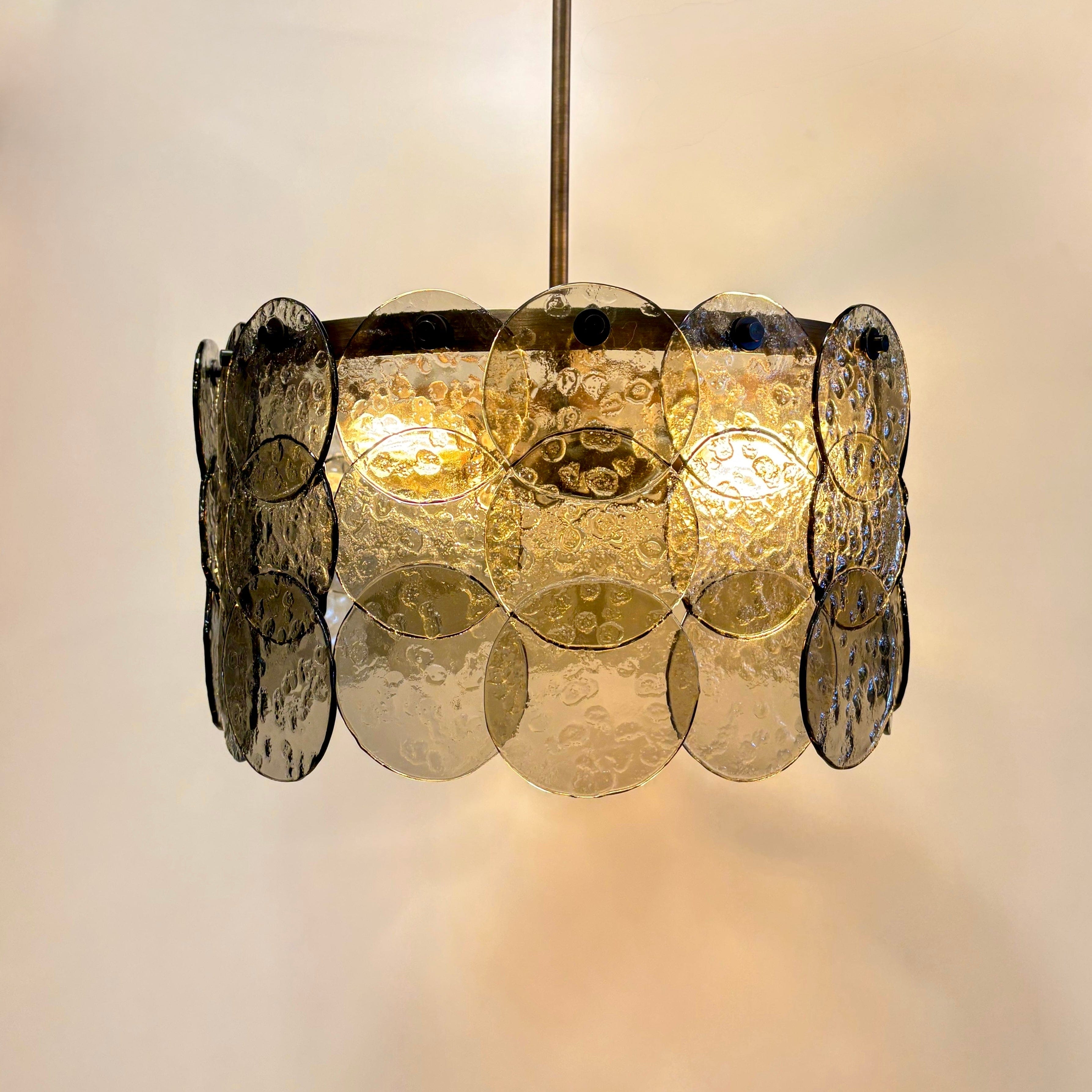 Brass chandelier in an elegant dining room — Arel Lighting