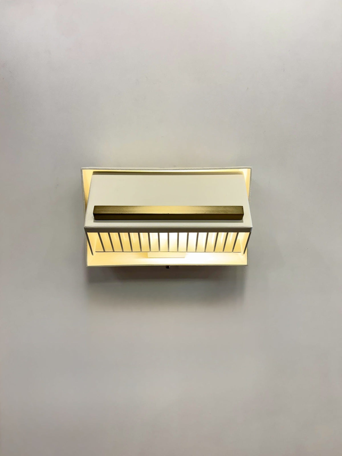 MURAFA cream wall sconce front view on grey wall
