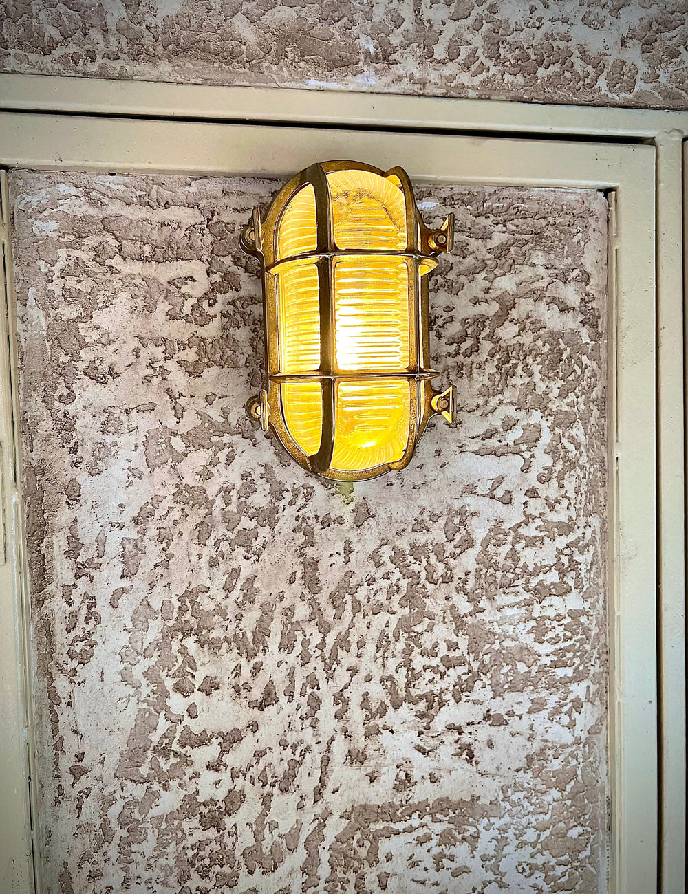 PINSK SMALL Nautical Wall Sconce on the entrance of a restaurant