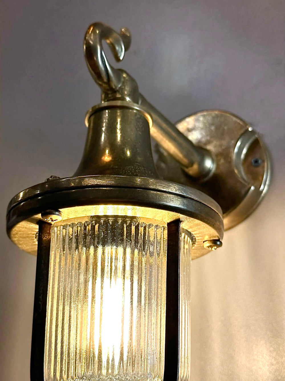 Nautical Sconce Outdoor lighting made of brass material and casted glass detail photo