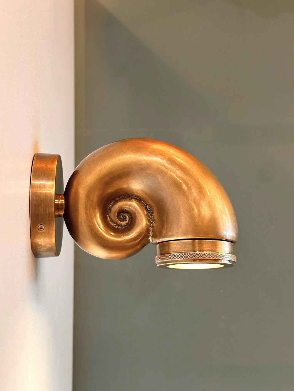 OUTDOOR bathroom wall sconce made of brass material inspired by sea shells