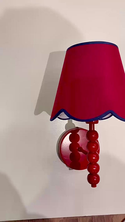 Video of the PROMIN red beaded wall sconce with scalloped fabric shade
